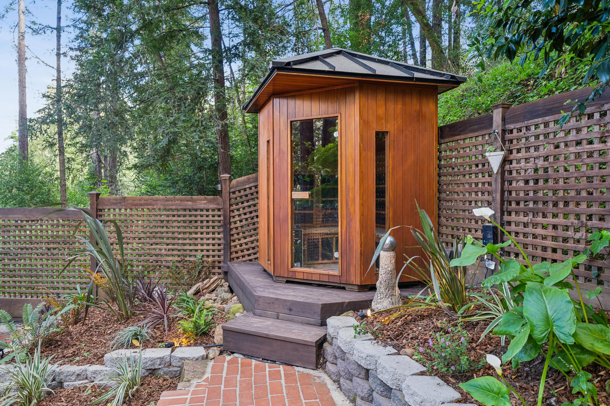 Cedar sauna nestled in the garden